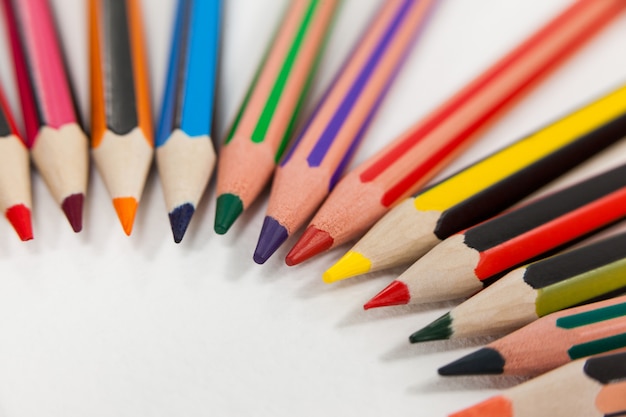 Colored pencils arranged in a semi-circle