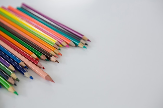 Colored pencils arranged in a wavy pattern