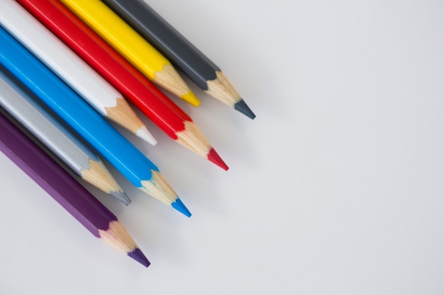 Colored pencils arranged in a wavy pattern