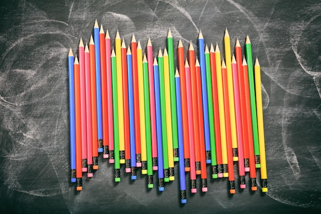 Colored pencils on a black board