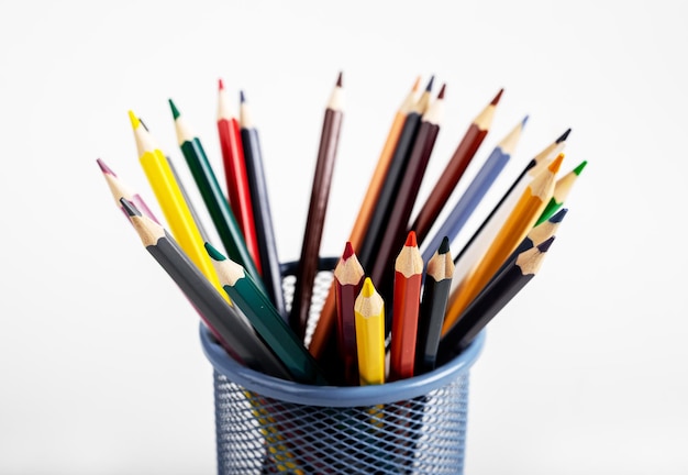 Colored pencils of different colour in metal holder