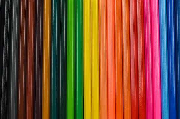 Colored pencils lie in a row The perfect blank for your desigTop view