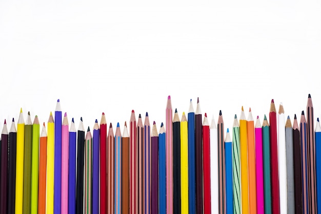 Colored pencils on table.