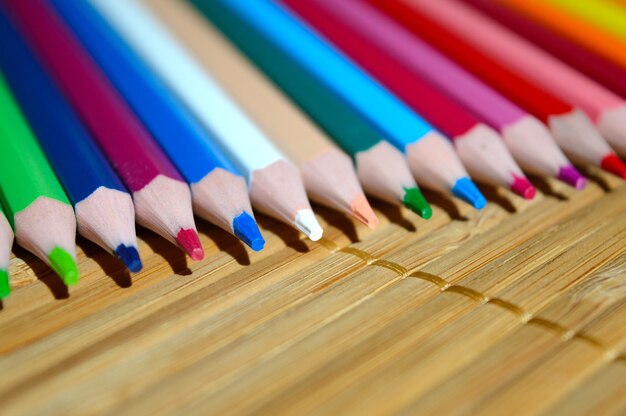 Colored Pencils On A Wooden Background