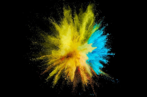 Colored powder explosion. Abstract closeup dust on backdrop. Colorful explode. Paint holi