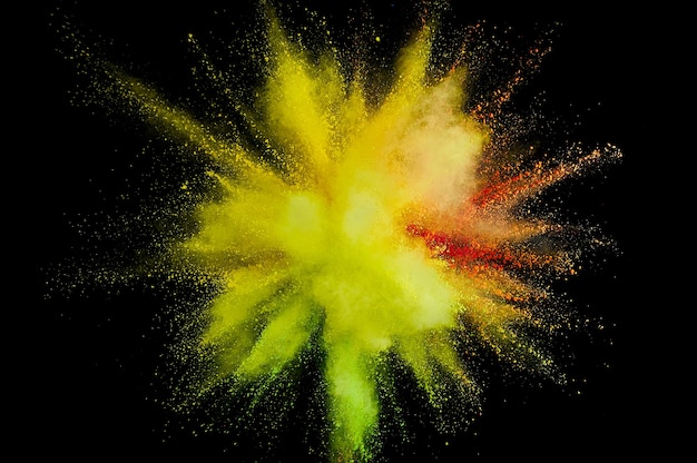 Colored powder explosion. Abstract closeup dust on backdrop. Colorful explode. Paint holi