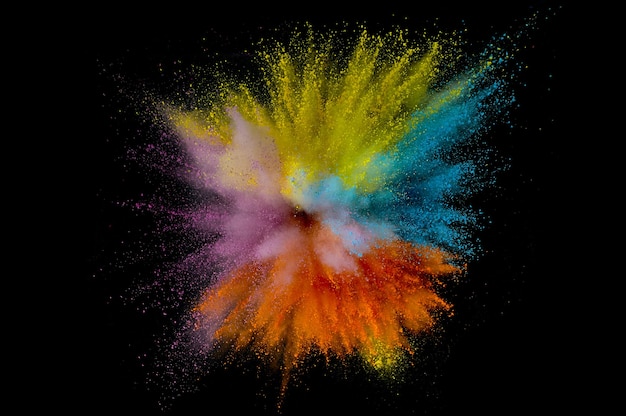 Colored powder explosion. Abstract closeup dust on backdrop. Colorful explode. Paint holi