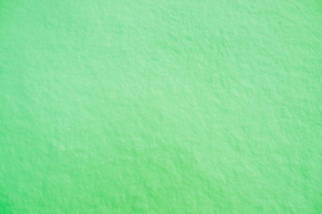 Colored snow as a background Green background