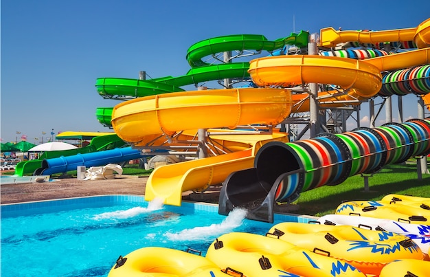 Colorful aquapark slide with pool for everyone