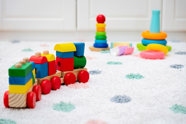 Colorful baby toys on a carpet