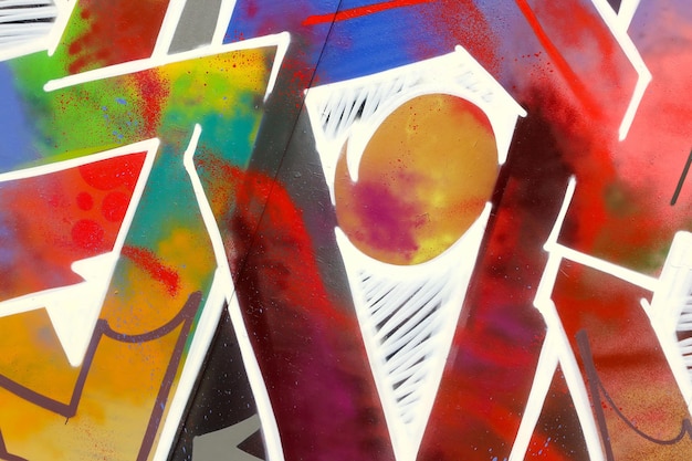 Colorful background of graffiti painting artwork with bright aerosol strips on metal wall