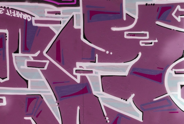 Colorful background of graffiti painting artwork with bright aerosol strips on metal wall