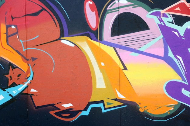 Colorful background of graffiti painting artwork with bright aerosol strips on metal wall