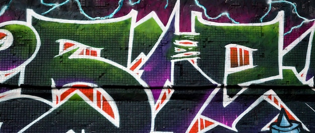 Colorful background of graffiti painting artwork with bright aerosol strips on metal wall