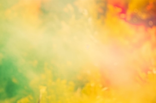 A colorful background with a green and red smoke