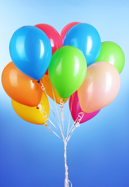 Colorful balloons on blue