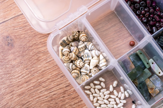 Colorful beads in containers close up handicrafts