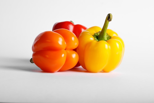 Colorful bell peppers isolated on white