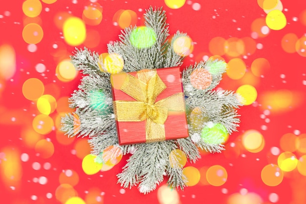 Colorful Bokeh with Red Christmas background with gift and green