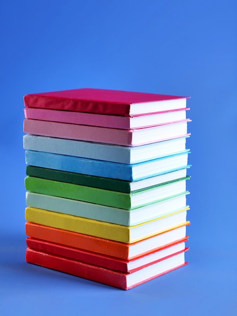 Colorful books on blue background