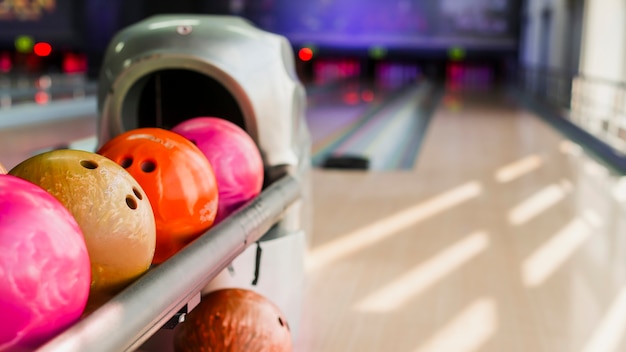 Colorful bowling balls on blurred background