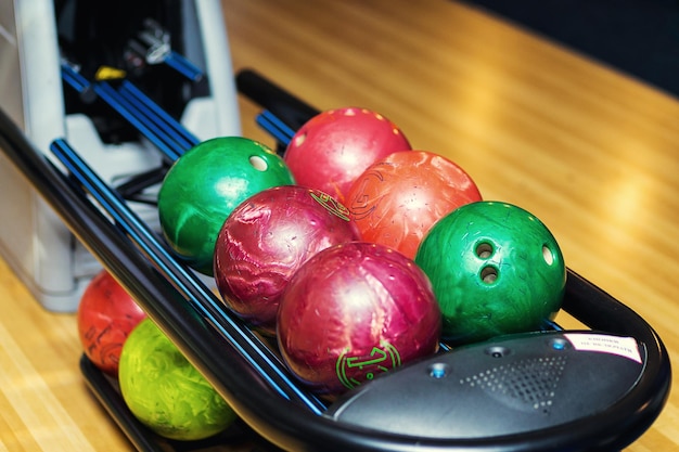 Colorful bowling ballsbawling ball waiting to be chosenballs has ready for player to throwing ball on the wooden lane and in the bowling hall