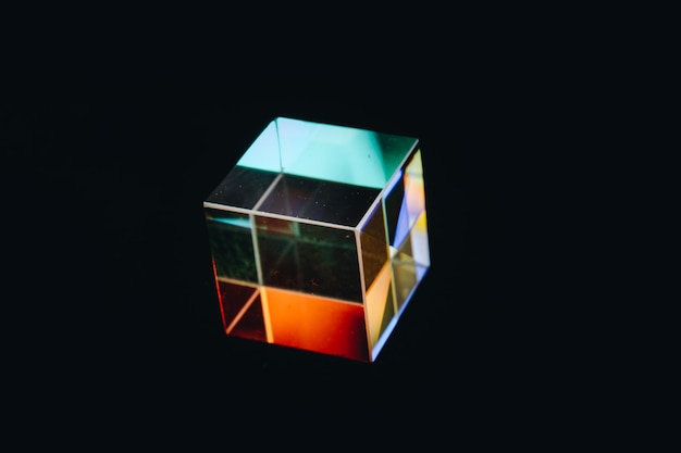 Colorful bright glass prism cube Refracting light in vivid rainbow colors