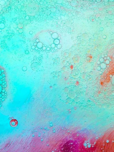 Colorful bubbles in backlit oily water