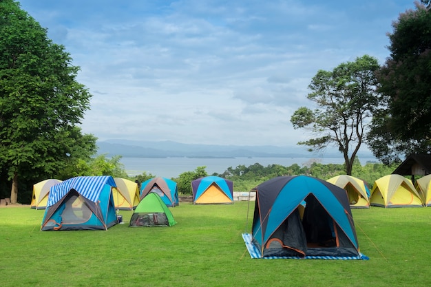 The Colorful Camping Tent near mountain river in the summer.