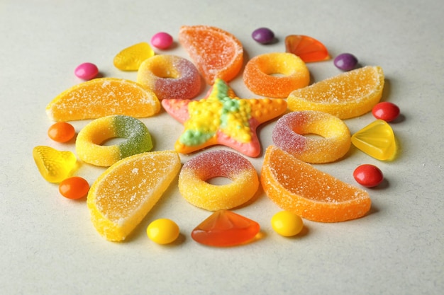 Colorful candies beautifully arranged on light background