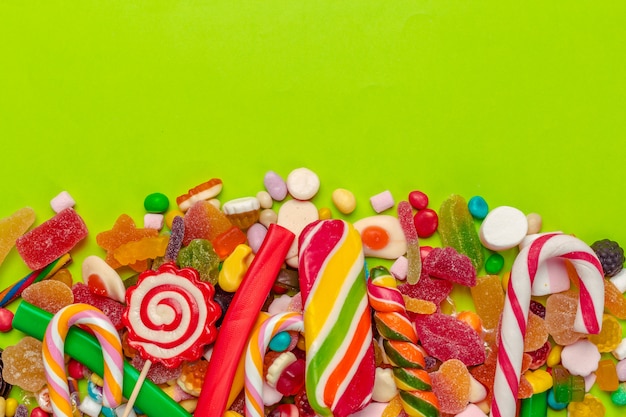 Colorful candies on green 