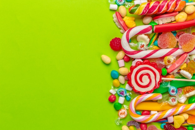 Colorful candies on green 