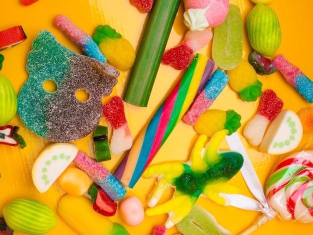 Colorful candies and jellies as background closeup