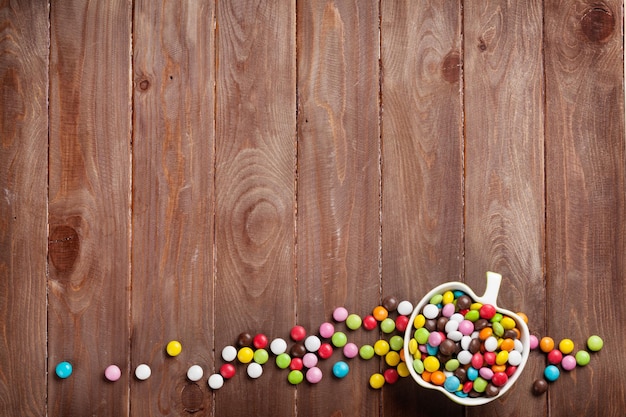 Colorful candies over wood