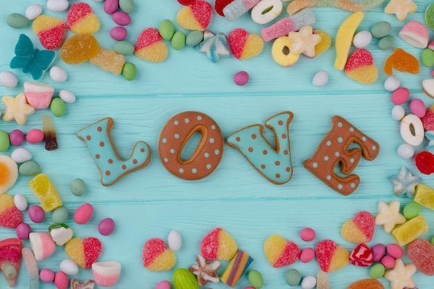 Colorful candies on wooden background