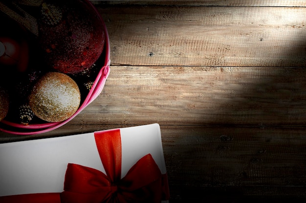 Colorful Christmas ball in the bucket and gift box with empty space