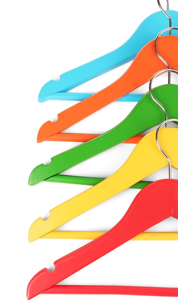 Colorful clothes hangers isolated on white