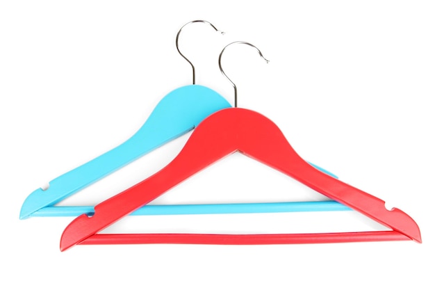 Colorful clothes hangers isolated on white