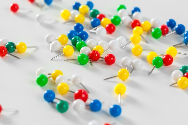 Colorful color push pins isolated on white 