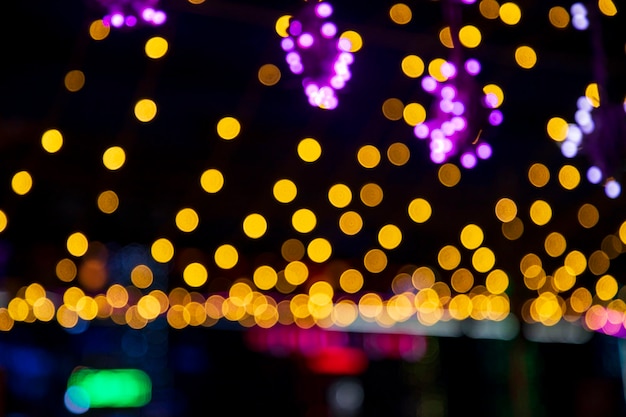 Colorful Defocus Abstract bokeh light effects on the street night black background texture wallpaper