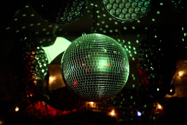 Colorful disco mirror ball lights night club background