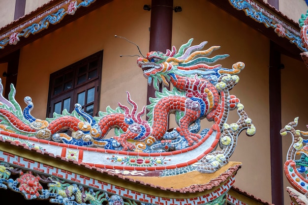 Colorful dragon sculpture on the roof In a Buddhist temple in Danang Vietnam