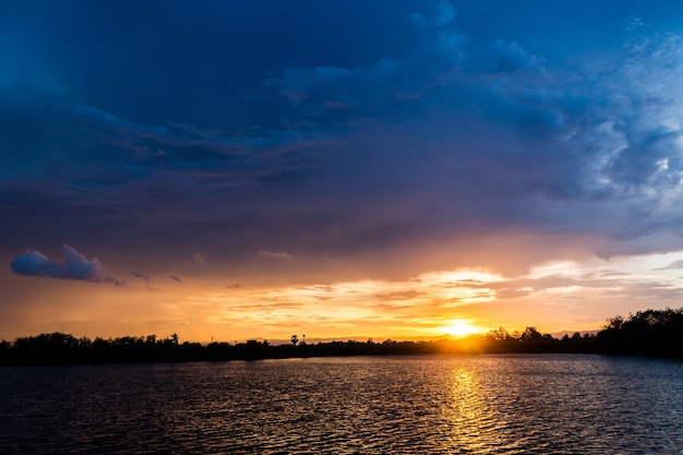 colorful dramatic sky with cloud at sunset.