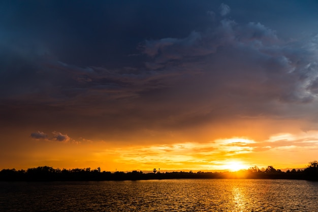 colorful dramatic sky with cloud at sunset.