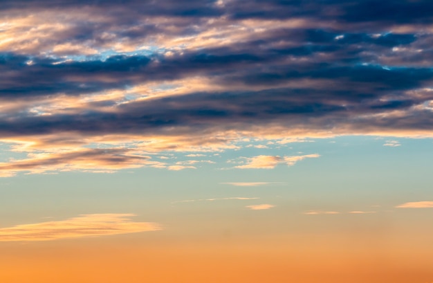 colorful dramatic sky with cloud at sunset.