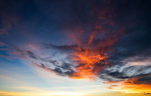 Colorful dramatic sky with cloud at sunset..