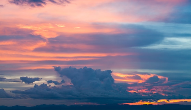 colorful dramatic sky with cloud at sunset.