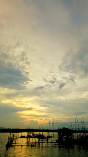 colorful dramatic sky with clouds at sunset. Sunset in  the lake