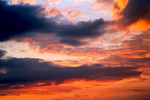 Colorful dramatic sky with clouds at sunset.