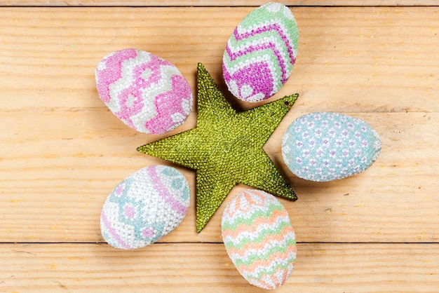 Colorful easter egg on a wooden table Happy Easter